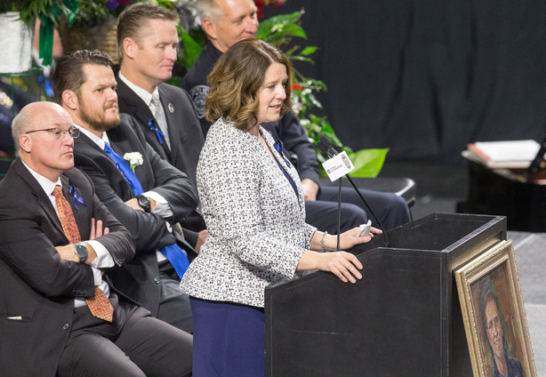 Erika Barney speaks during funeral services for her husband, Unified police officer Doug Barney, at the Maverik Center in West Valley City Monday, Jan. 25, 2016. (Photo: Scott G Winterton, Deseret News)