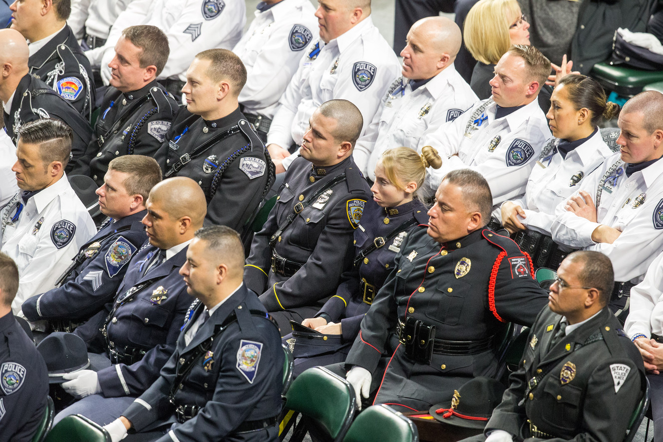 Law enforcement officers from across the nations listen during funeral services for Unified police officer Doug Barney at the Maverik Center in West Valley City on Monday, Jan. 25, 2016. (Photo: Scott G Winterton, Deseret News)