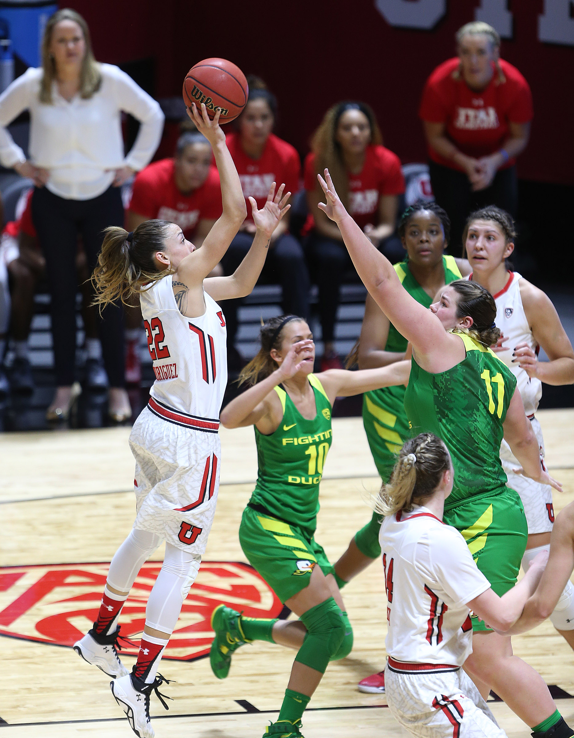 Utah Utes guard Danielle Rodriguez (22) pushes up a shot over Oregon Ducks forward Liz Brenner (11) as Utah and Oregon play at the Huntsman Center in Salt Lake City Sunday, Jan. 24, 2016. (Scott G. Winterton/Deseret News)