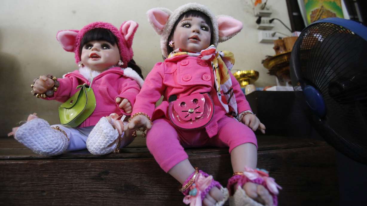 In latest fad, Thais treat 'child angel' dolls like pets