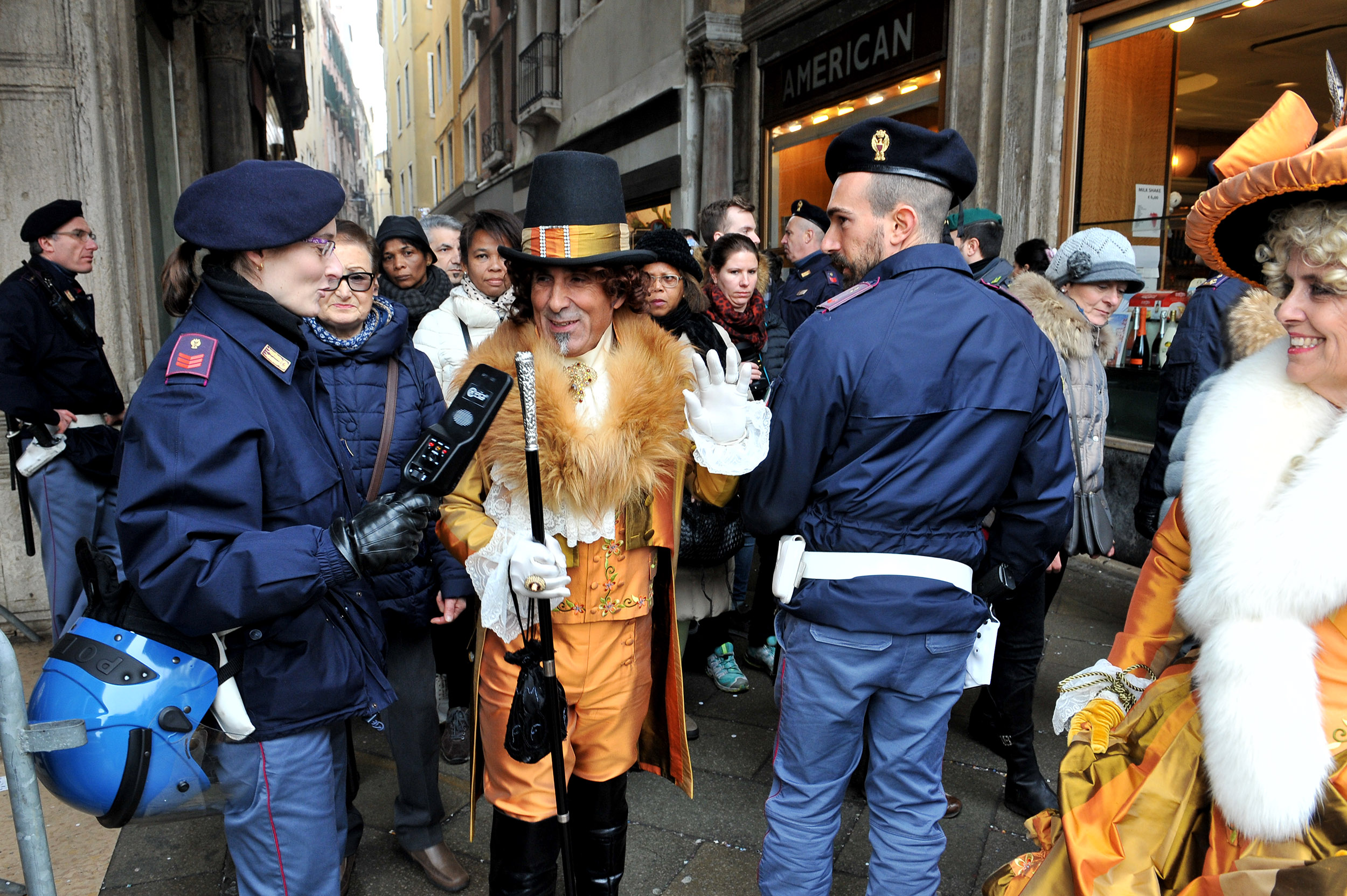 Police ask Venice carnival-goers to lift masks for security
