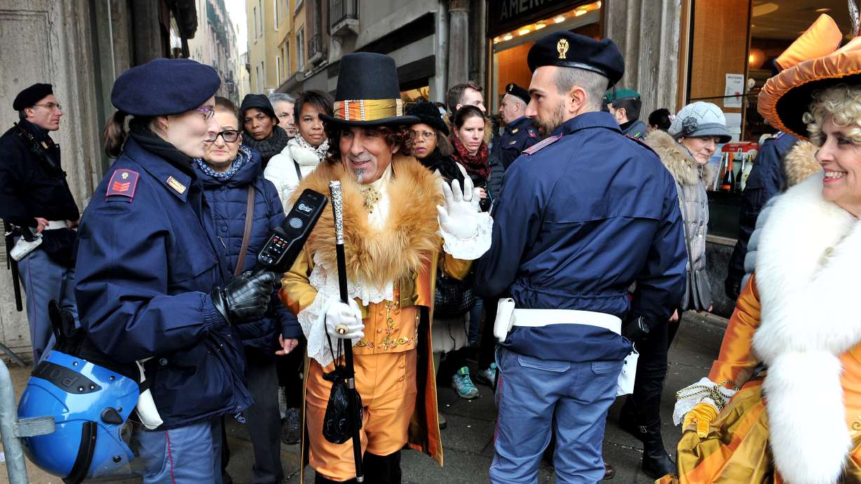 Police ask Venice carnival-goers to lift masks for security