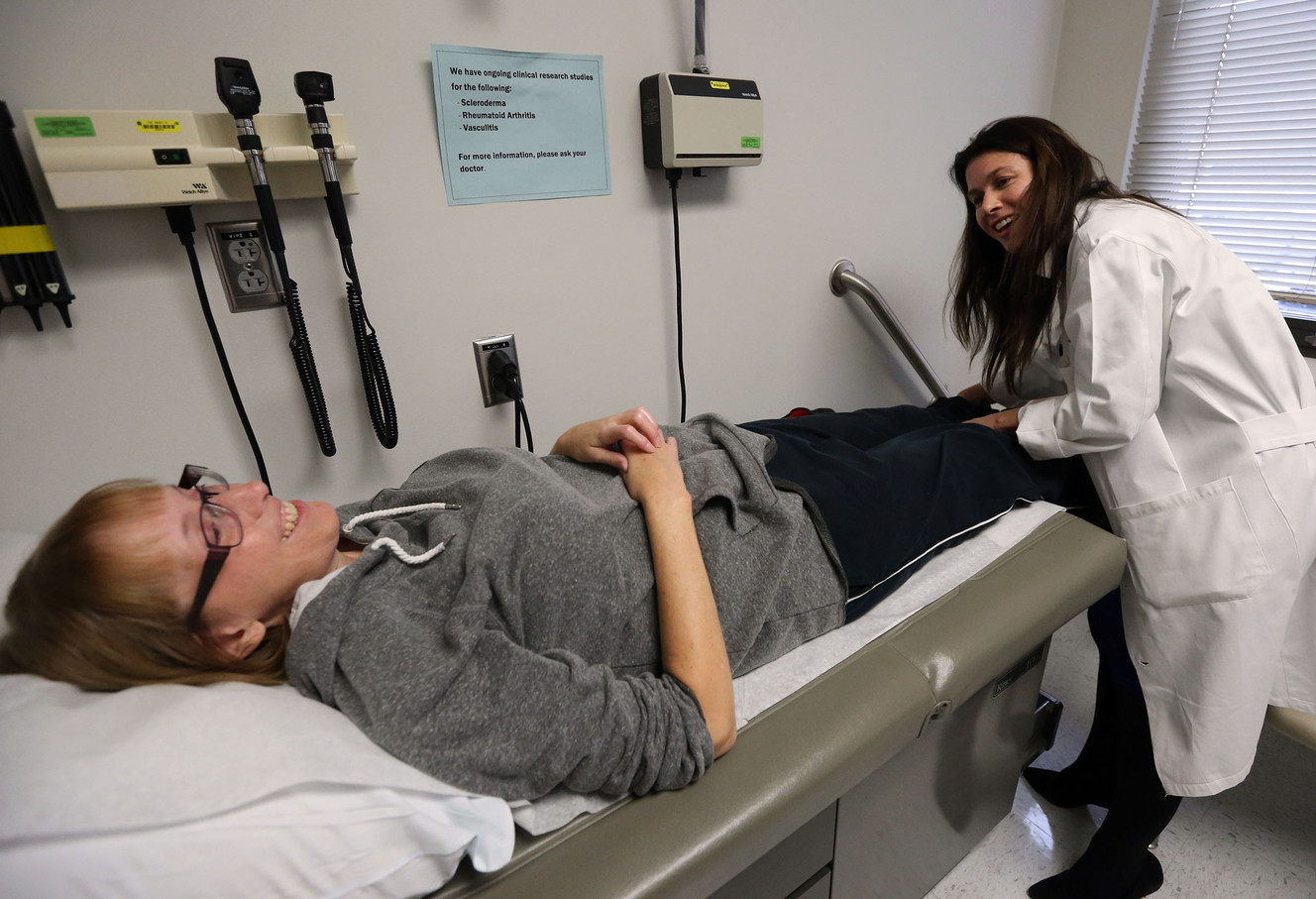 Dr. Tracy Frech looks at Kristie Griffiths' feet while examining her to see if she's eligible to participate in a study of a new drug to treat scleroderma, or systemic sclerosis, at University Hospital in Salt Lake City on Thursday, Jan. 14, 2016. (Photo: Kristin Murphy, Deseret News)