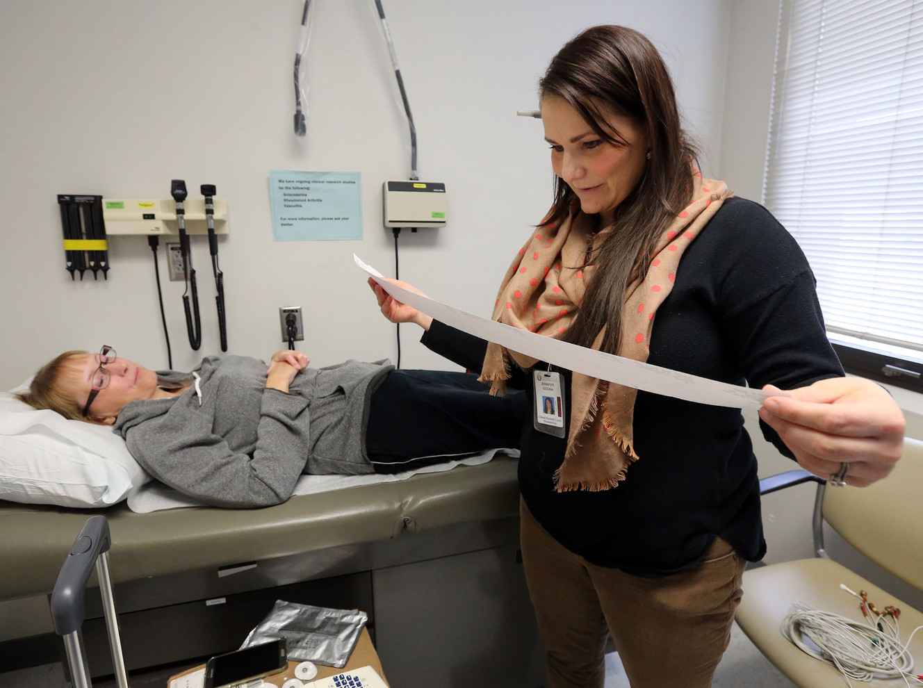 Jennifer Godina, clinical research coordinator, looks over an EKG printout for Kristie Griffiths during an exam to see if she's eligible to be part of a study of a new drug to treat scleroderma, or systemic sclerosis, at University Hospital in Salt Lake City on Thursday, Jan. 14, 2016. (Photo: Kristin Murphy, Deseret News)