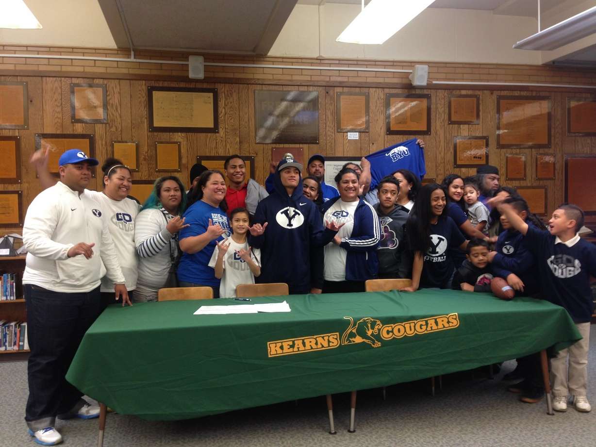 Sione Finau with most of his available immediate and extended family after signing a Letter of Intent to join BYU's football team in 2018 following a two-year LDS Church mission, Wednesday, Feb. 3, 2016. (Photo: Sean Walker, KSL.com)