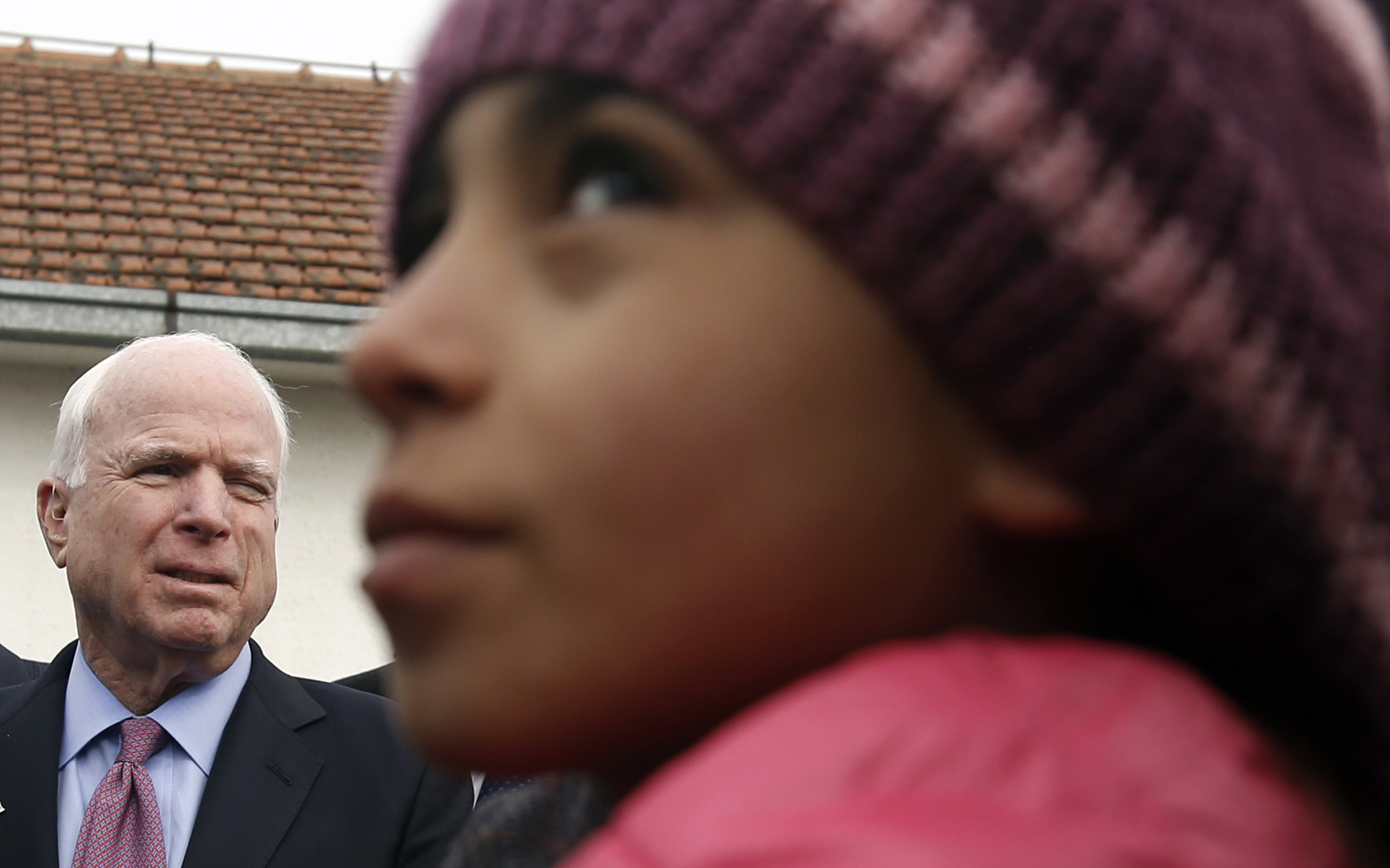 The Latest: Official: Half of Calais camp to be evacuated