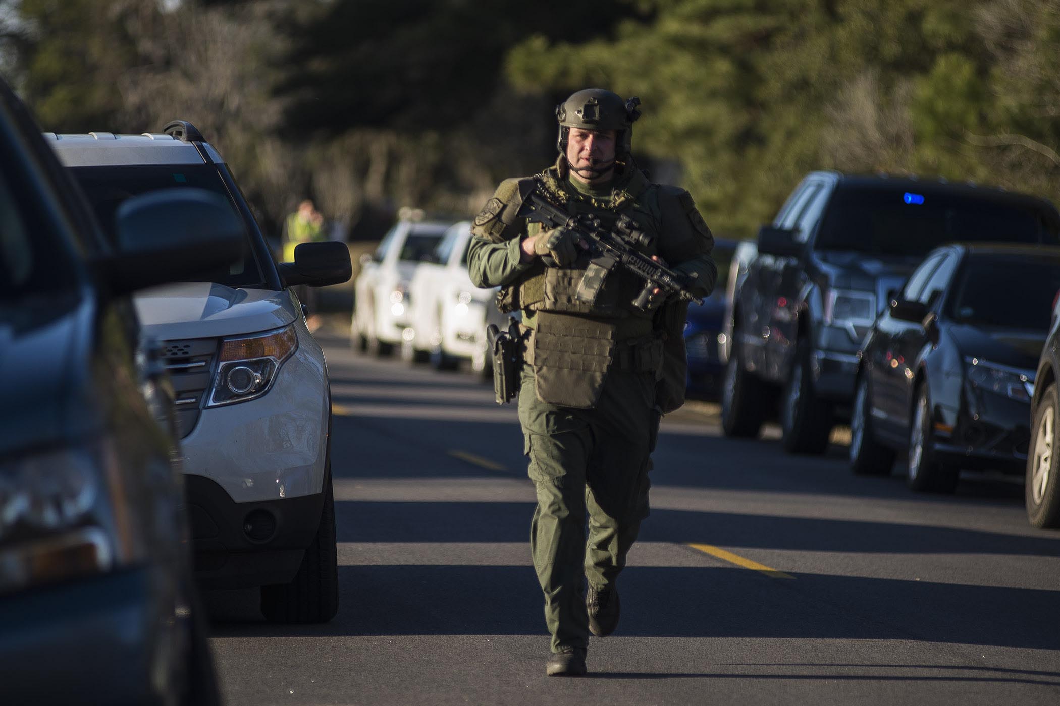 The Latest: Man charged with murder in officer's killing