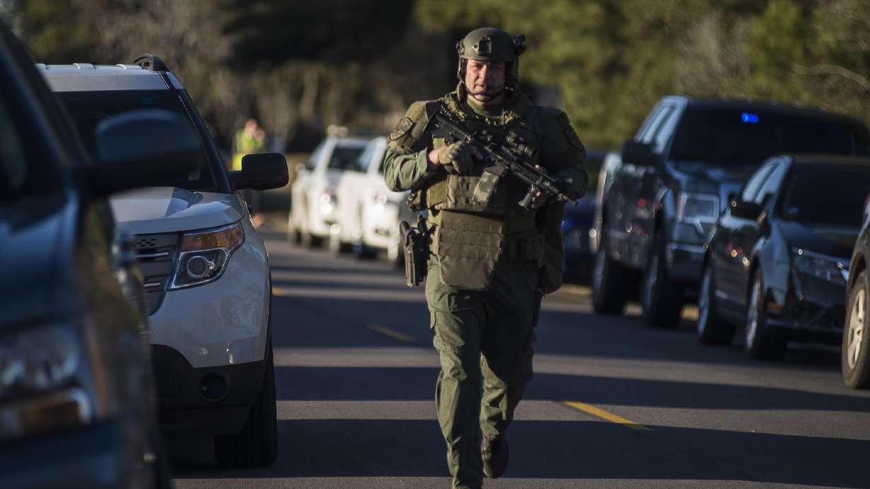 The Latest: Man charged with murder in officer's killing