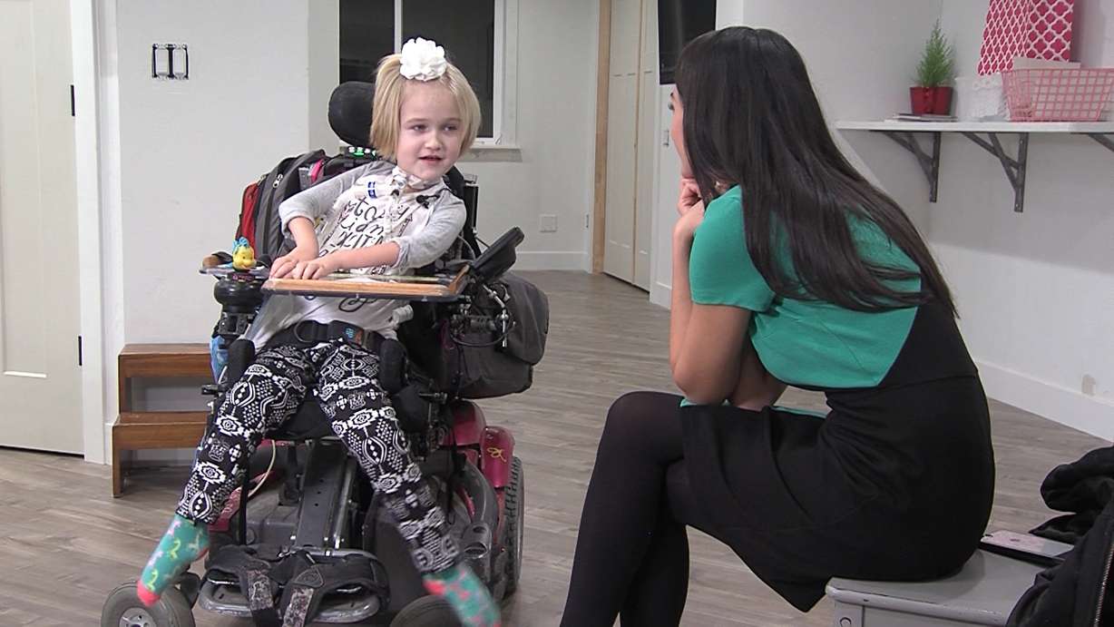 Presley Gleason, 7, talks to KSL's Ashley Moser about her excitement for the new wheelchair accessible playground that will be built at Orem's City Center Park. (Photo: Brandon Whitworth, KSL-TV)