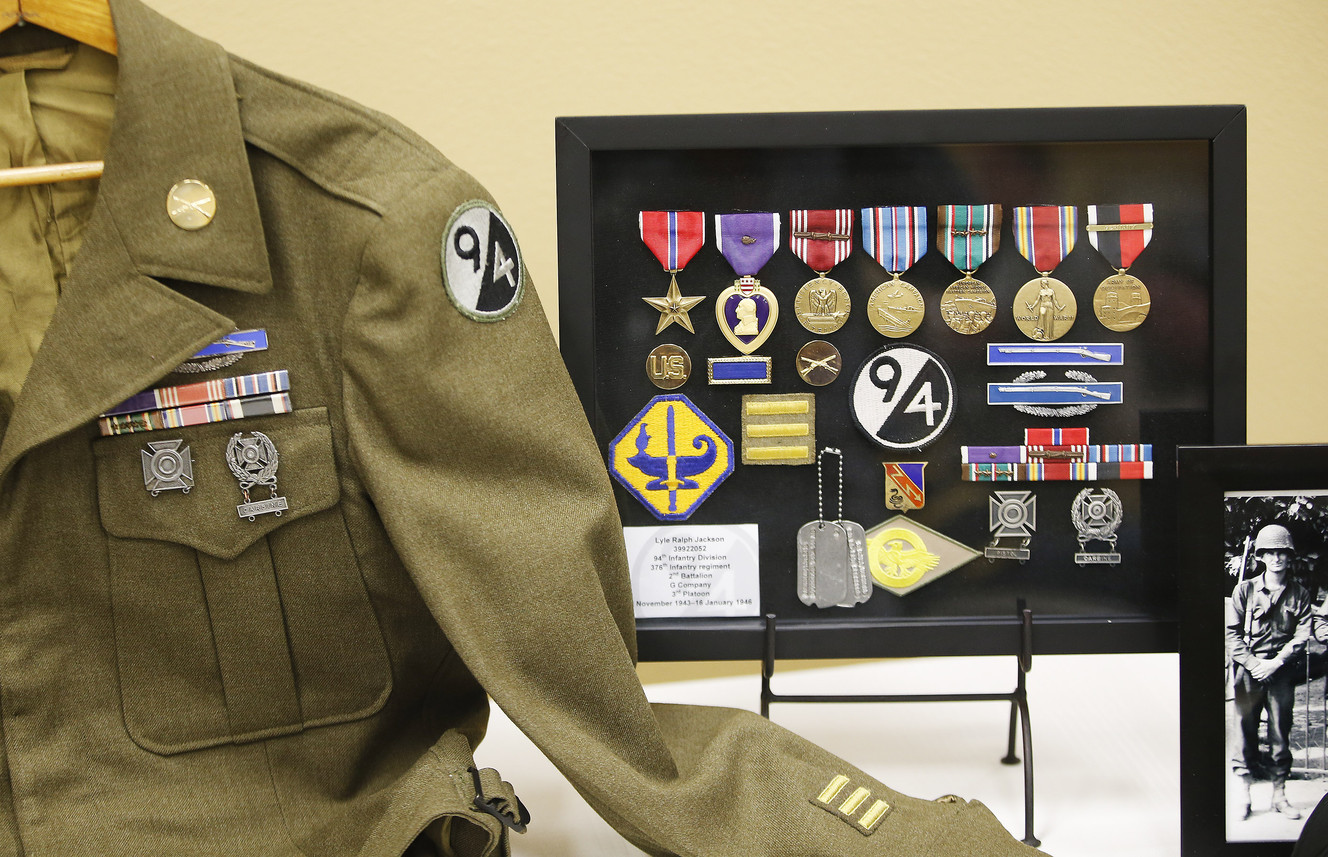 A memorabilia table shows military items of Lyle Ralph Jackson in South Jordan Saturday, Feb. 13, 2016. Jackson, 91, was honored for his role in liberating France during World War II. (Photo: Jeffrey D. Allred, Deseret News)