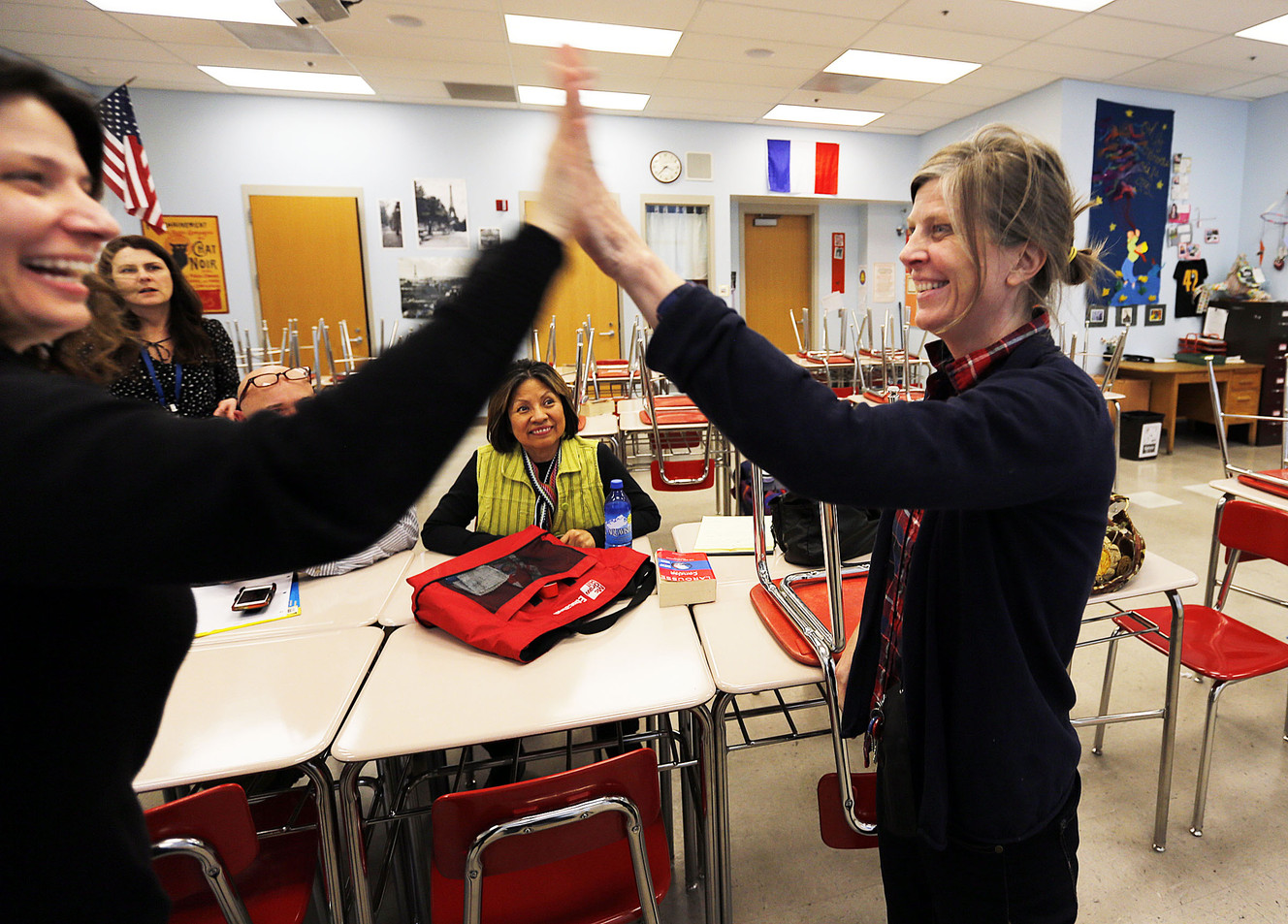 Dessie Olson, left, congratulates Laura Nelson at East High School in Salt Lake City on Wednesday, Feb. 10, 2016, after Laura announced she is going to Africa for conflict resolution professional development. (Photo: Ravell Call/Deseret News)