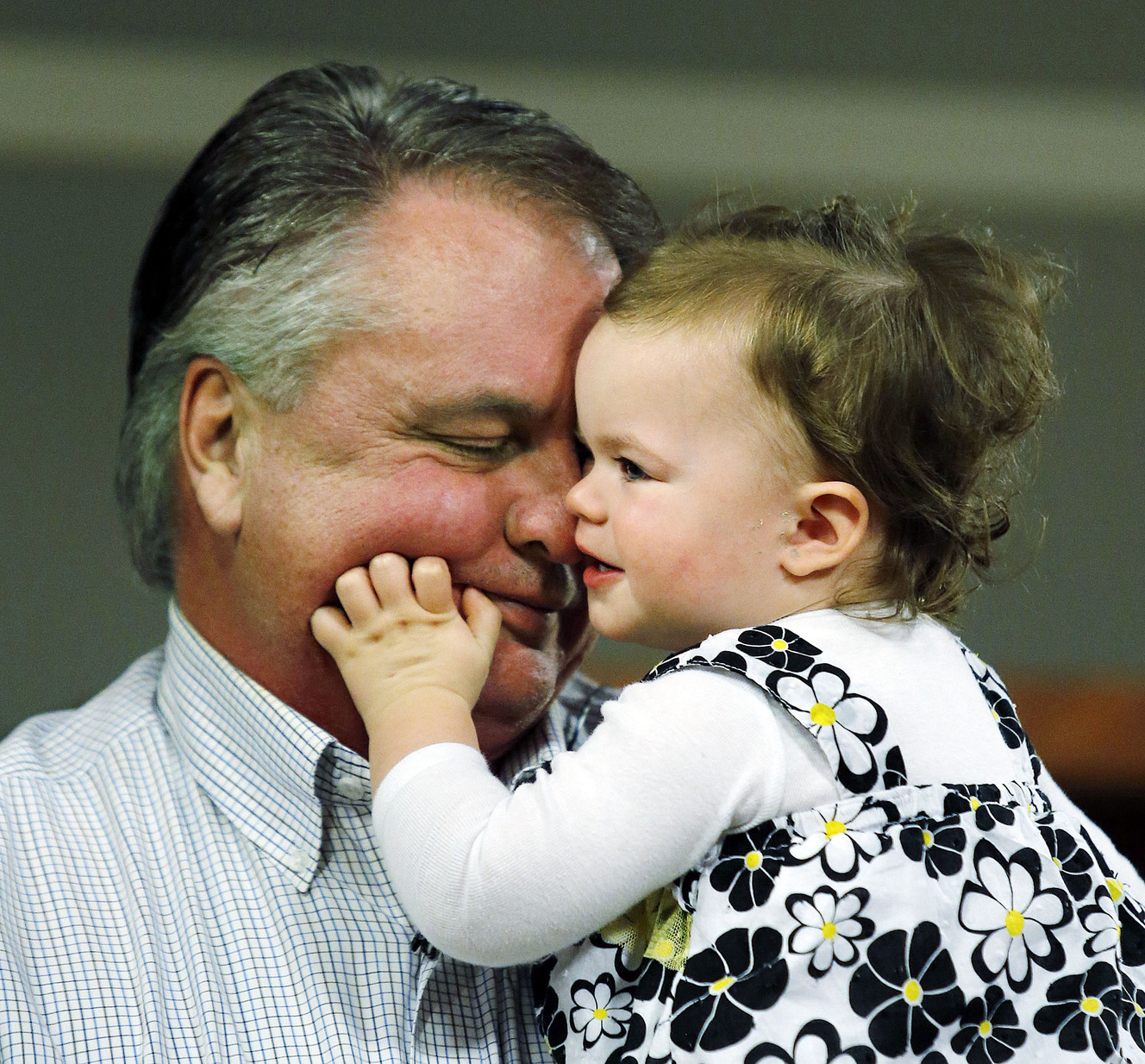 Chad Groesbeck holds his granddaughter, Lily Groesbeck during an interview in Salt Lake City, Monday, March 16, 2015. 18-month-old Lily survived 14 hours trapped in a car upside down in the Spanish Fork River. (Photo: Ravell Call, Deseret News)