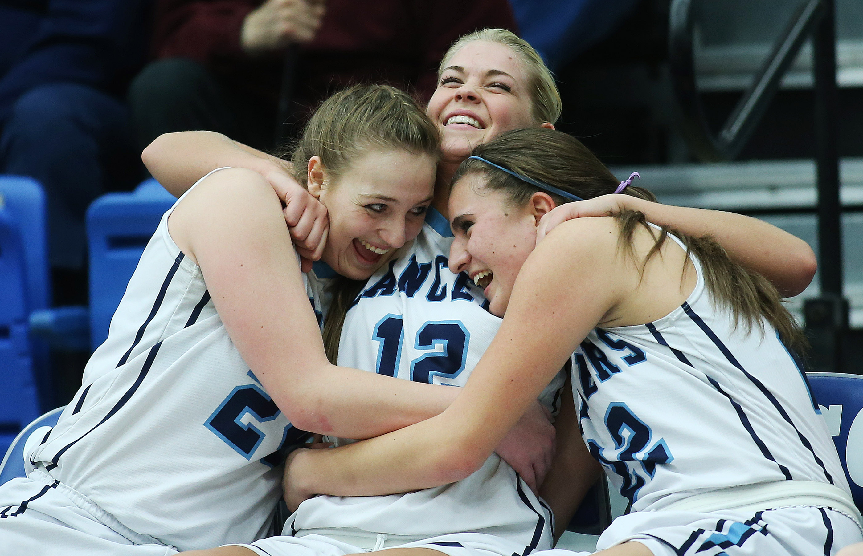 Layton's Kelsey Foster, Hailey Bassett and Livia Borges hug at the end of the game with Pleasant Grove in the 5A high school girls basketball quarterfinal game in Taylorsville Thursday, Feb. 25, 2016. (Photo: Jeffrey D. Allred, Deseret News)