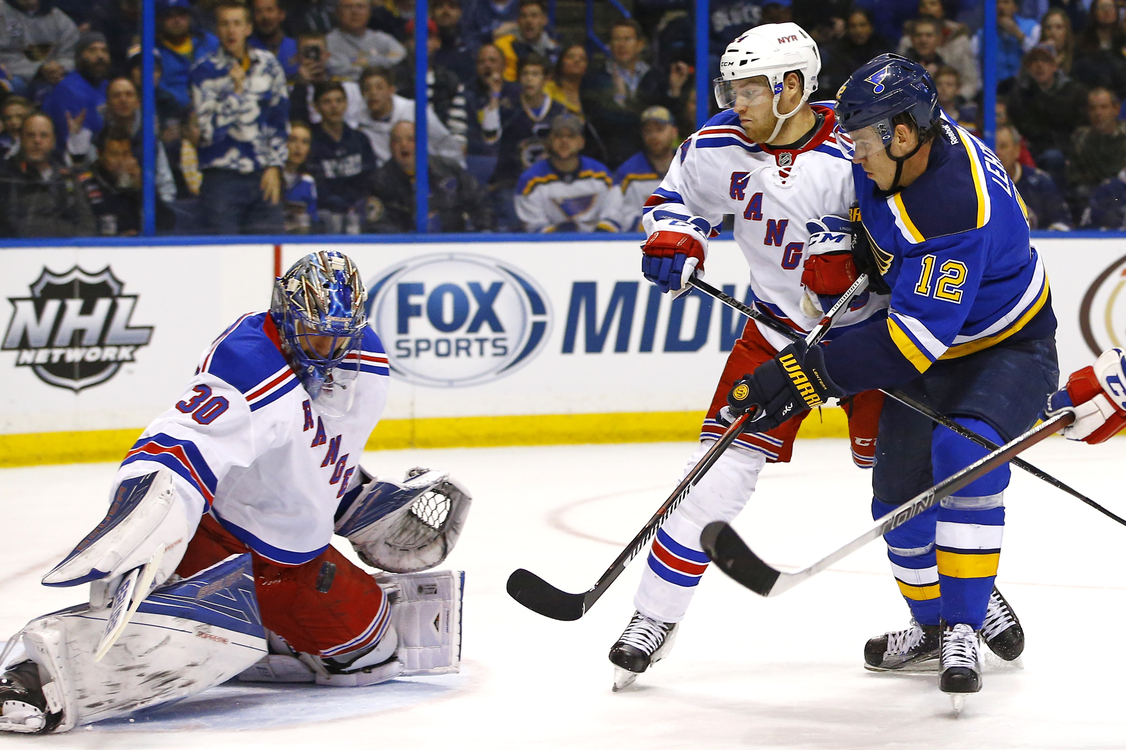 Lundqvist has milestone night as Rangers beat Blues 2-1