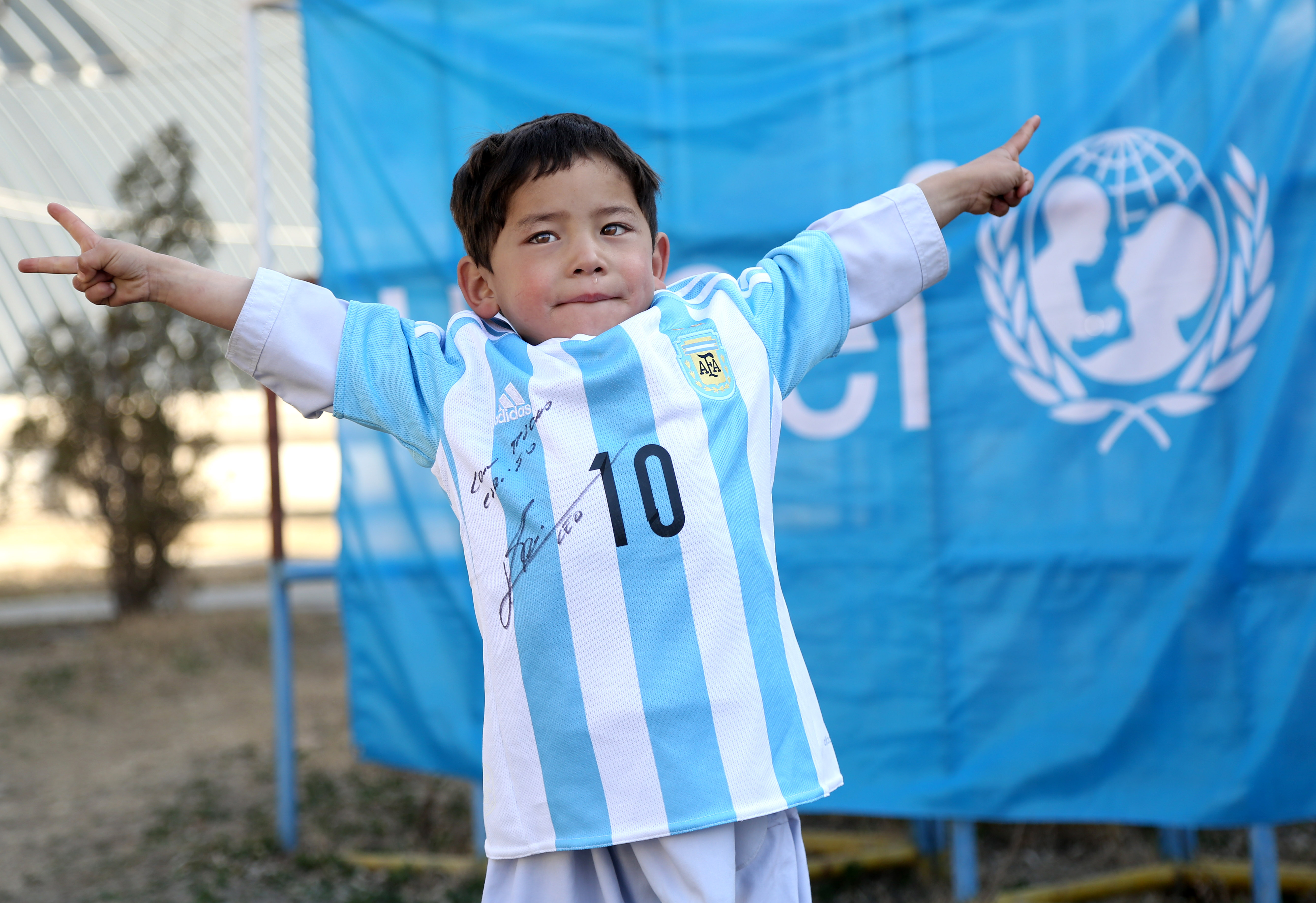 Afghan boy in homemade shirt looking to meet Lionel Messi