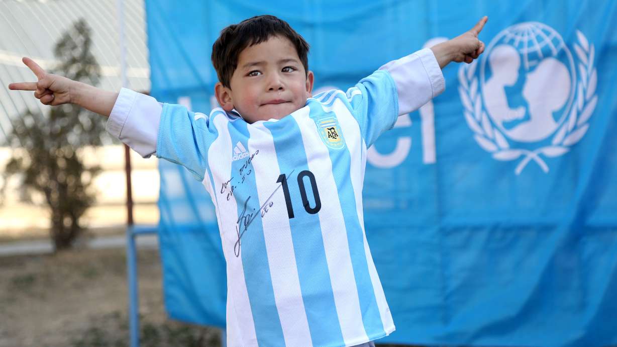 Afghan boy in homemade shirt looking to meet Lionel Messi