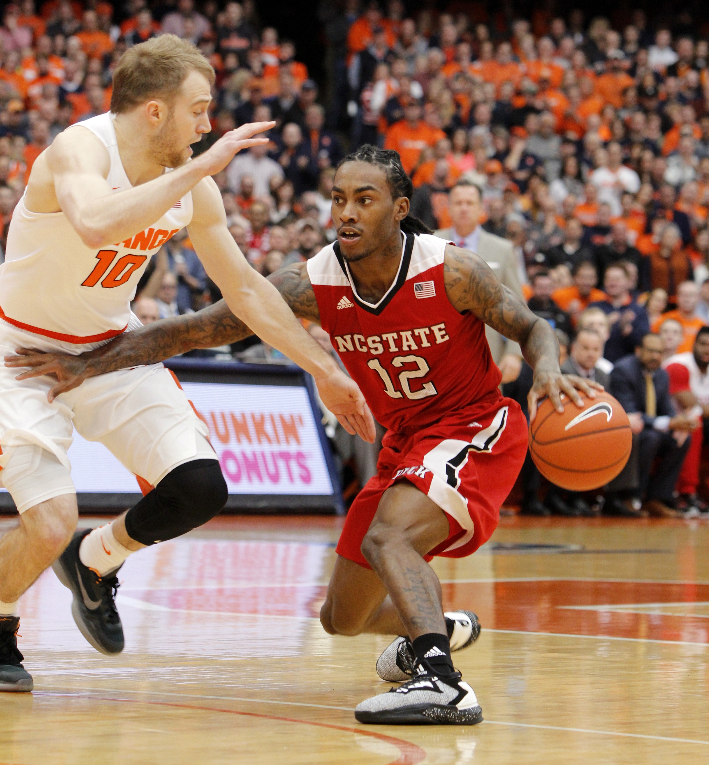 Syracuse beats NC State 75-65 behind Gbinije
