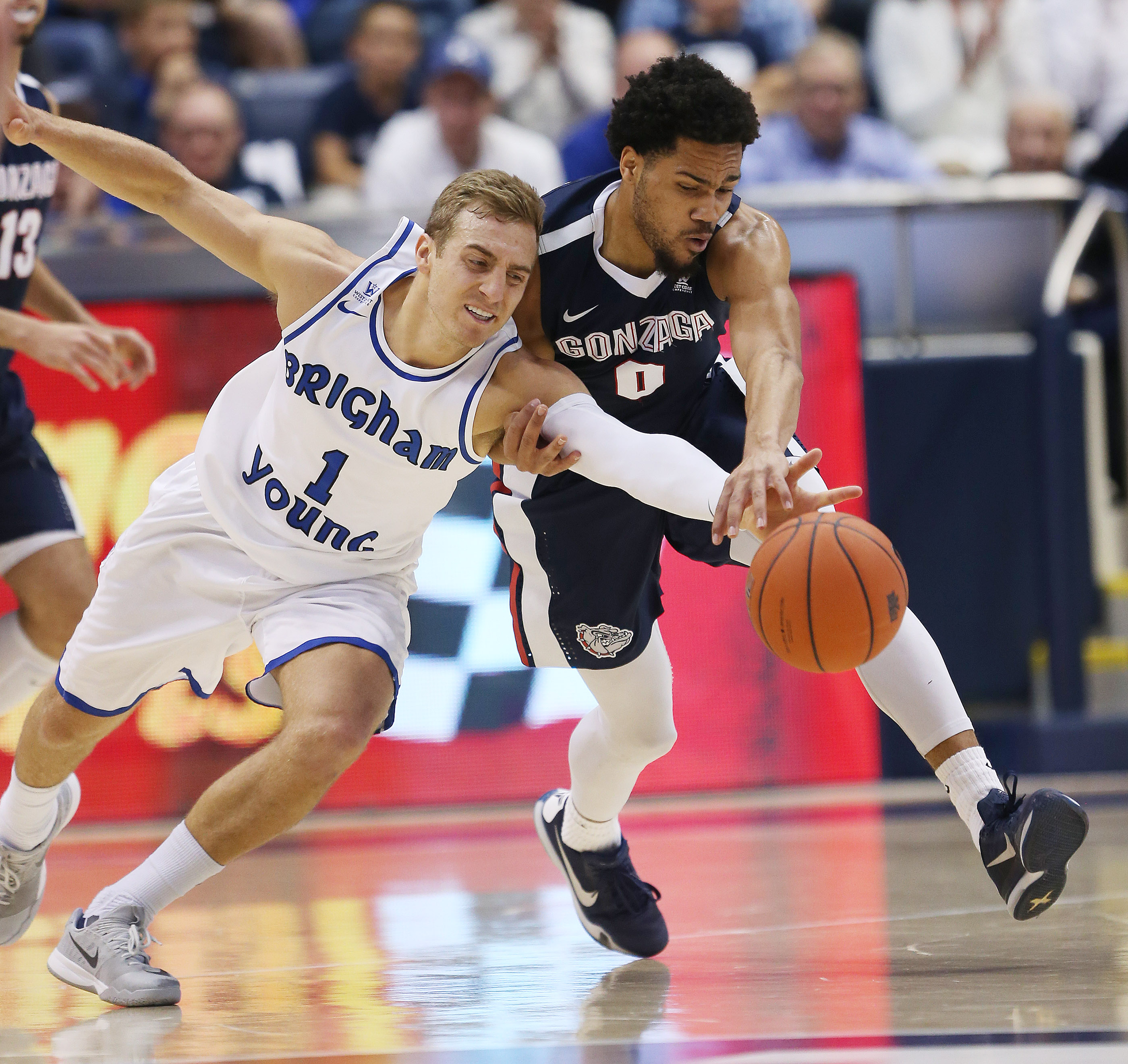 BYU guard Chase Fischer (1) and Gonzaga Bulldogs guard Silas Melson (0) fight for the ball in Provo Saturday, Feb. 27, 2016. Gonzaga won 71-68. (Photo: Jeffrey D. Allred, Deseret News)