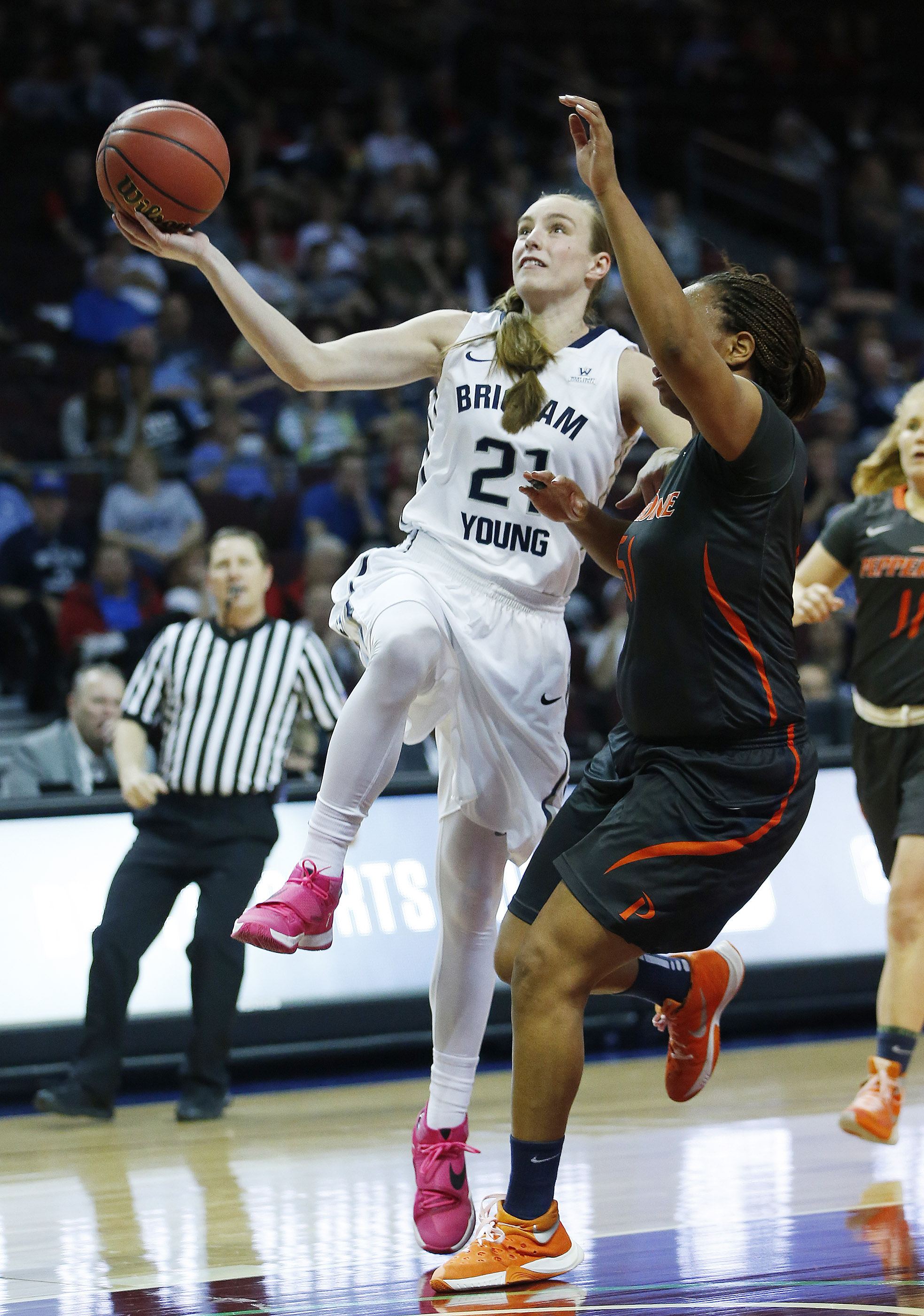 BYU guard Lexi Eaton Rydalch (21) drives on Pepperdine guard/forward Keitra Wallace (51) during the WCC Tournament in Las Vegas Friday, March 4, 2016. BYU won 72-59. (Photo: Jeffrey D. Allred, Deseret News)