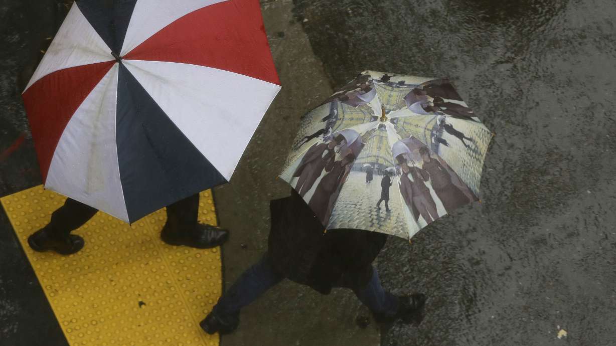 The Latest: Woman died after being trapped in submerged car