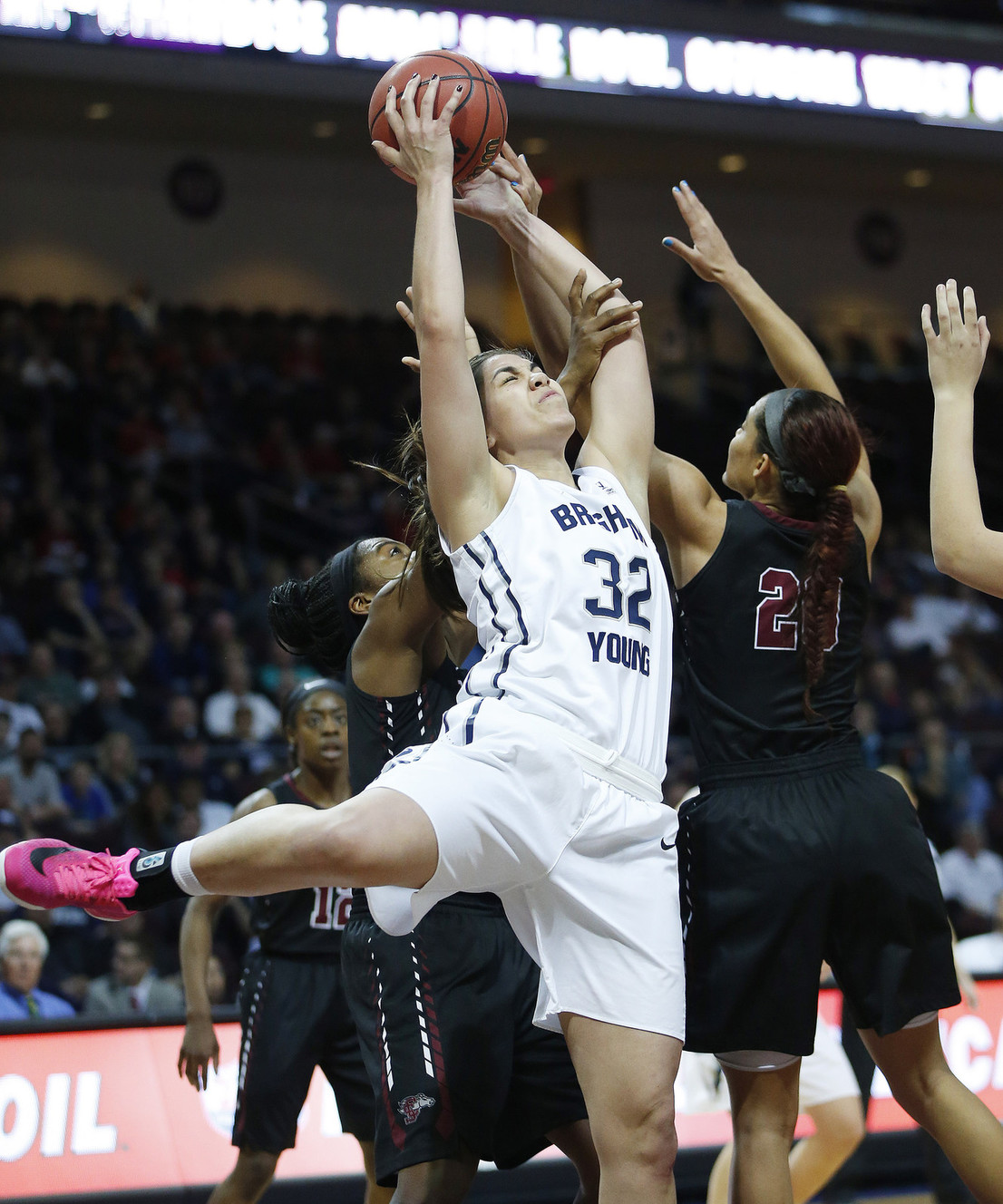 BYU forward Kalani Purcell (32) tries to shoot over Santa Clara guard Brooke Gallaway (22) and forward Lori Parkinson (behind) during the WCC tournament in Las Vegas Monday, March 7, 2016. BYU won 87-67. (Photo: Jeffrey D. Allred, Deseret News)