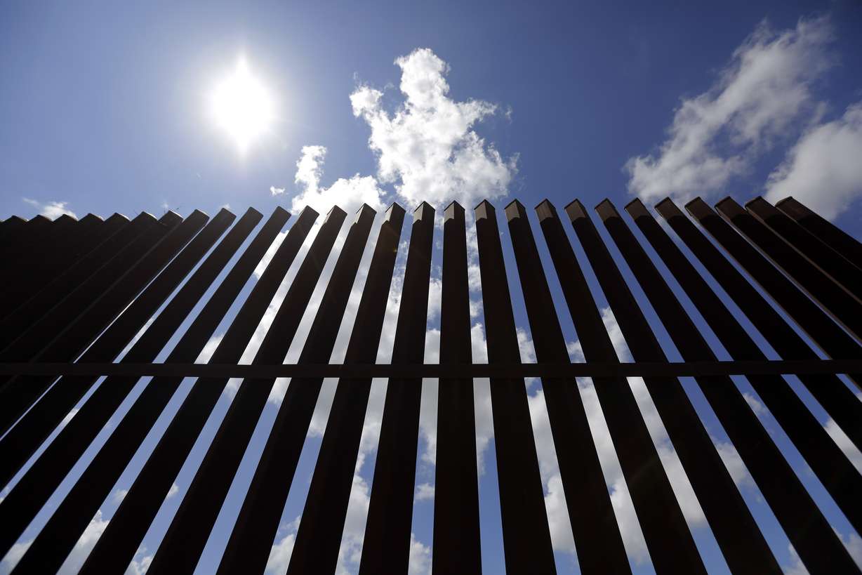 In this Sept. 15, 2015, photo, a borer fence a farmers property, Tuesday, in Mission, Texas. Photo: Eric Gay/AP Photo