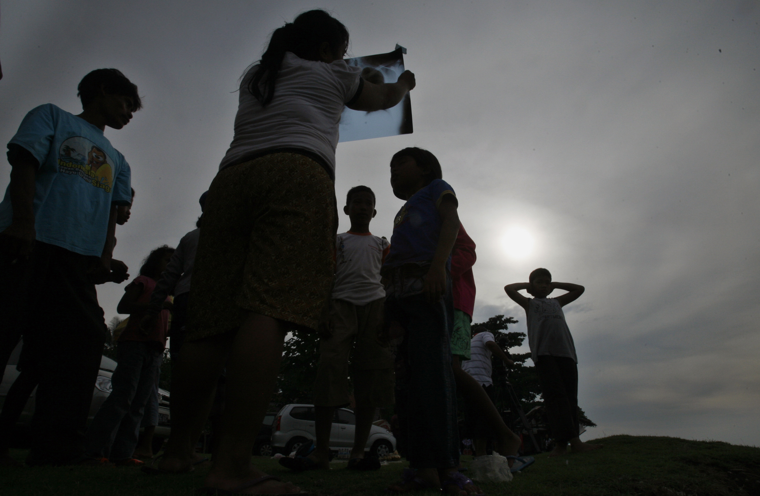 Prayers, cheers as total eclipse darkens swath of Asia