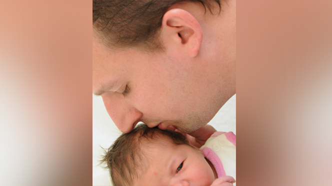 The undated photo provided by his father Juergen Fischenich shows Germanwings crash victim Sven Fischenich kissing his daughter after her birth. Fischenich died when a Germanwings plane from Barcelona to Duesseldorf crashed in the French Alps on March 24, 2015. (Courtesy of Juergen Fischenich via AP)