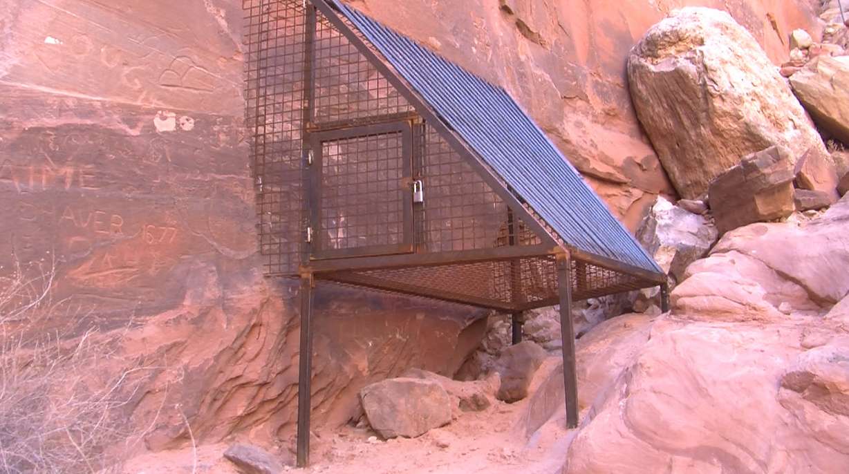 Steel cage erected to protect historic 1776 Lake Powell inscription