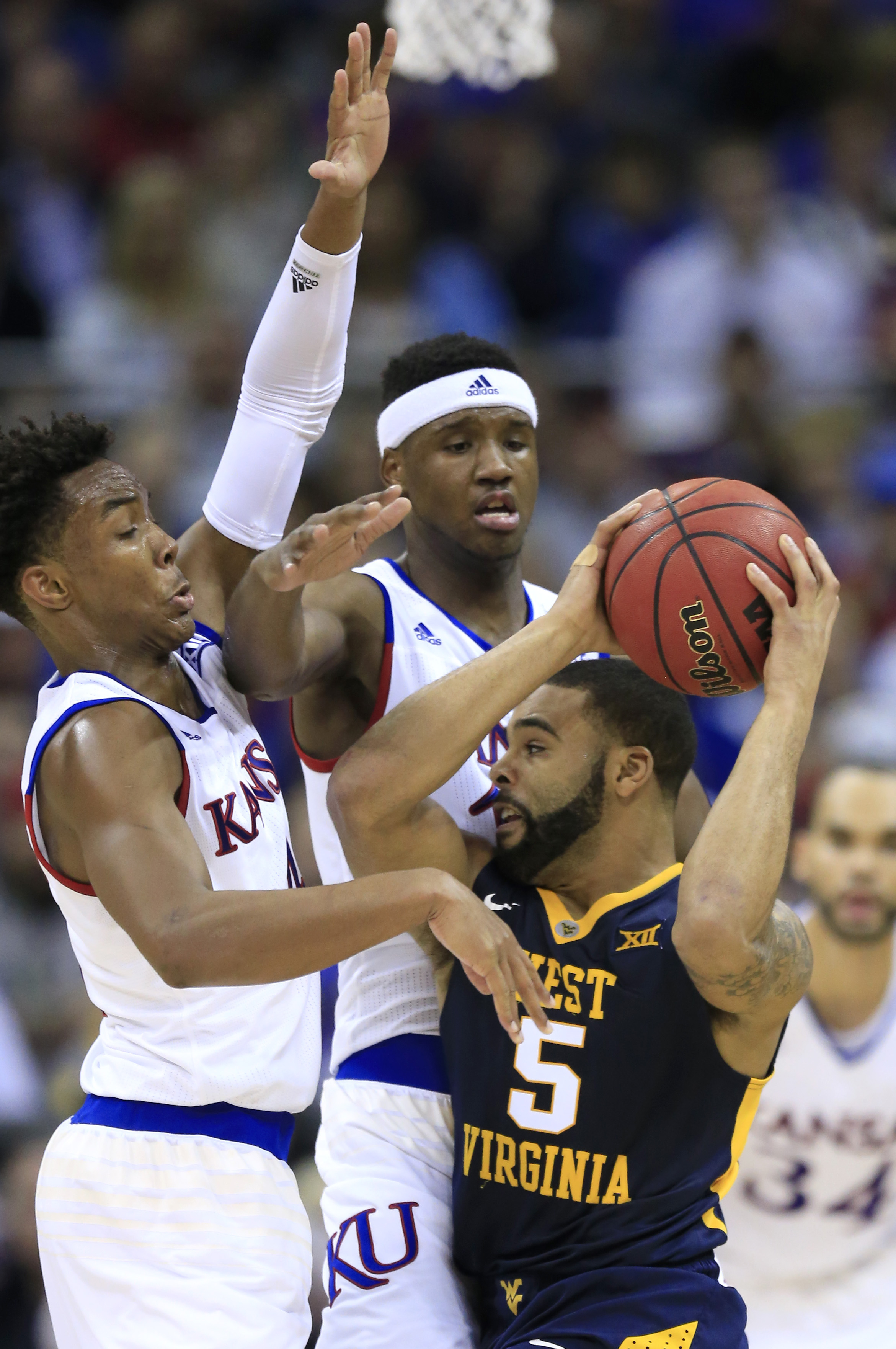 No. 1 Kansas beats No. 9 West Virginia for Big 12 title