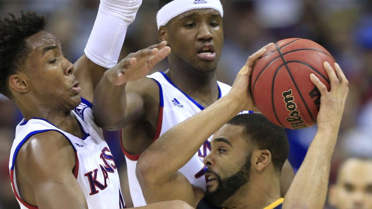 No. 1 Kansas beats No. 9 West Virginia for Big 12 title