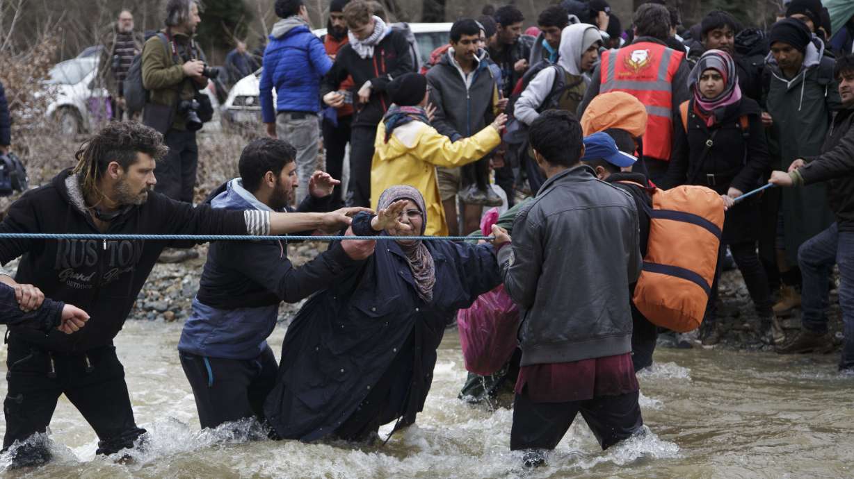 The Latest: Turkey says deal with EU has humanitarian factor