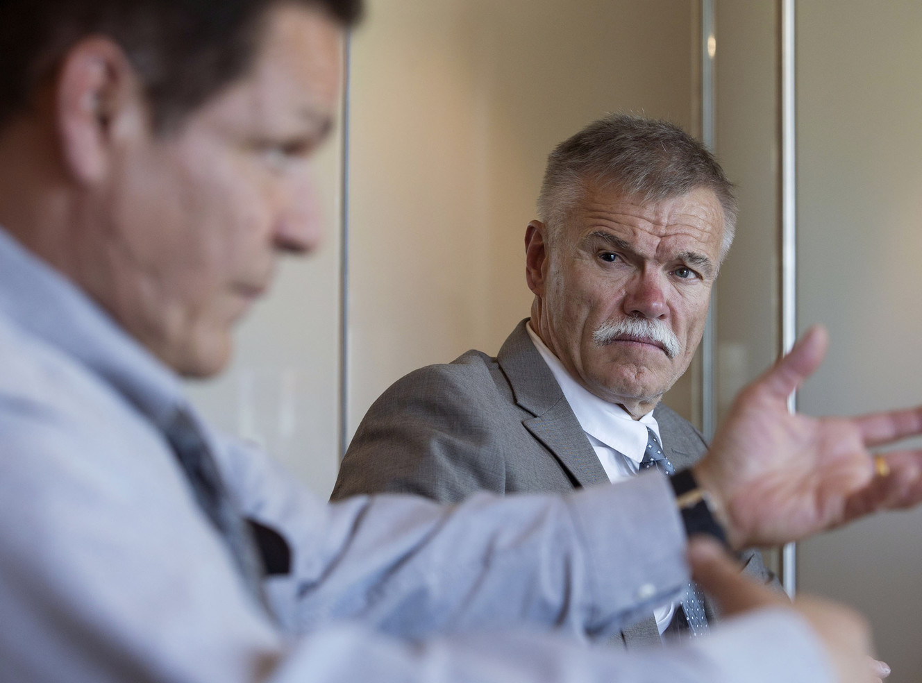 Brent V. Manning listens as Richard Ramirez talks about the time he served in the Utah State Prison during an interview at the law firm of Manning Curtis Bradshaw & Bednar LLC in Salt Lake City on Thursday, March 10, 2016. (Photo: Laura Seitz, Deseret News)
