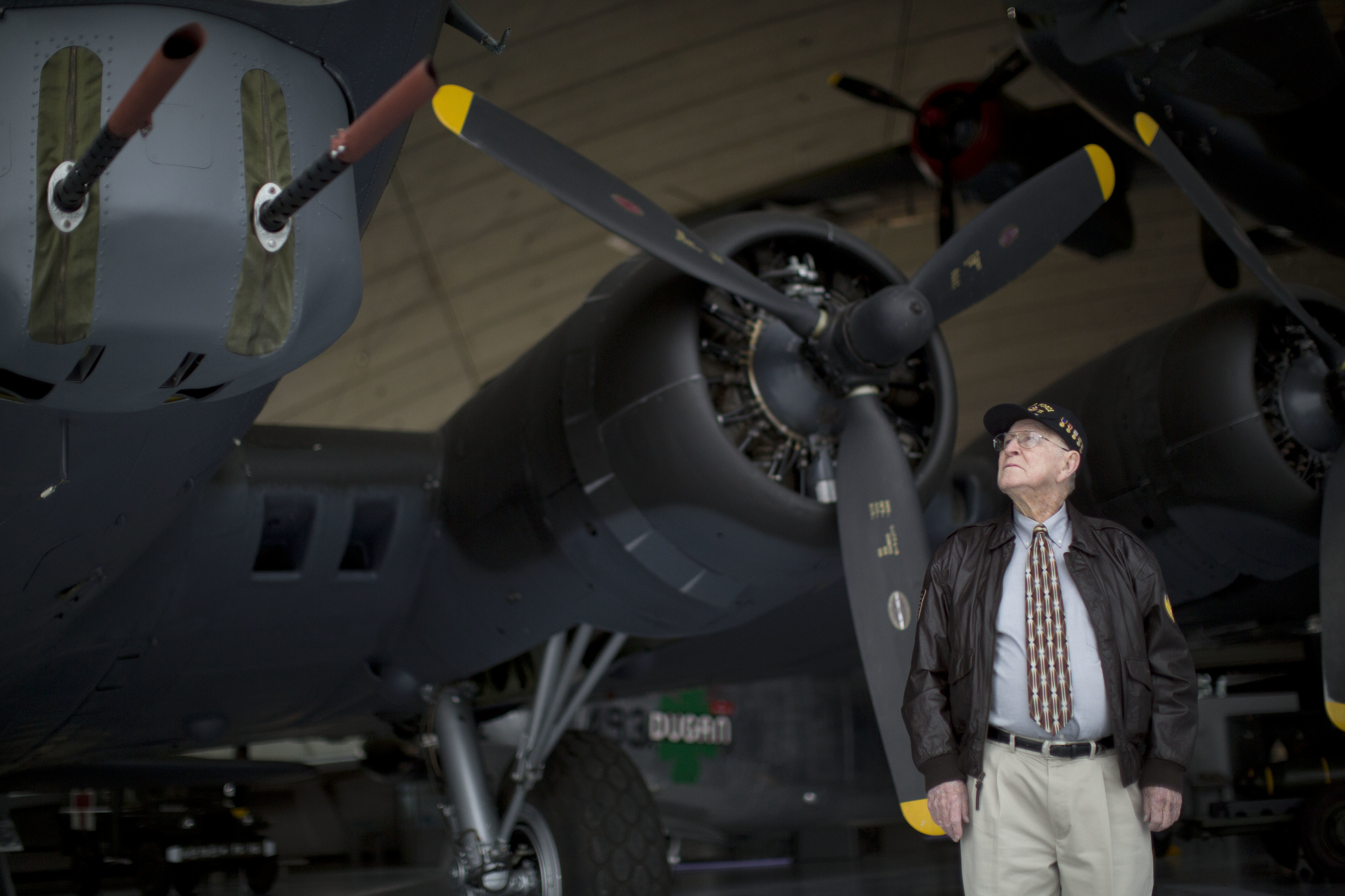 Bill Toombs, aged 91, from Little Rock, Arkansas, who was a flight engineer on B-24 and B-27 aircraft in World War II, poses for photographs next to a Boeing B-17G Flying Fortress. Photo: AP Photo