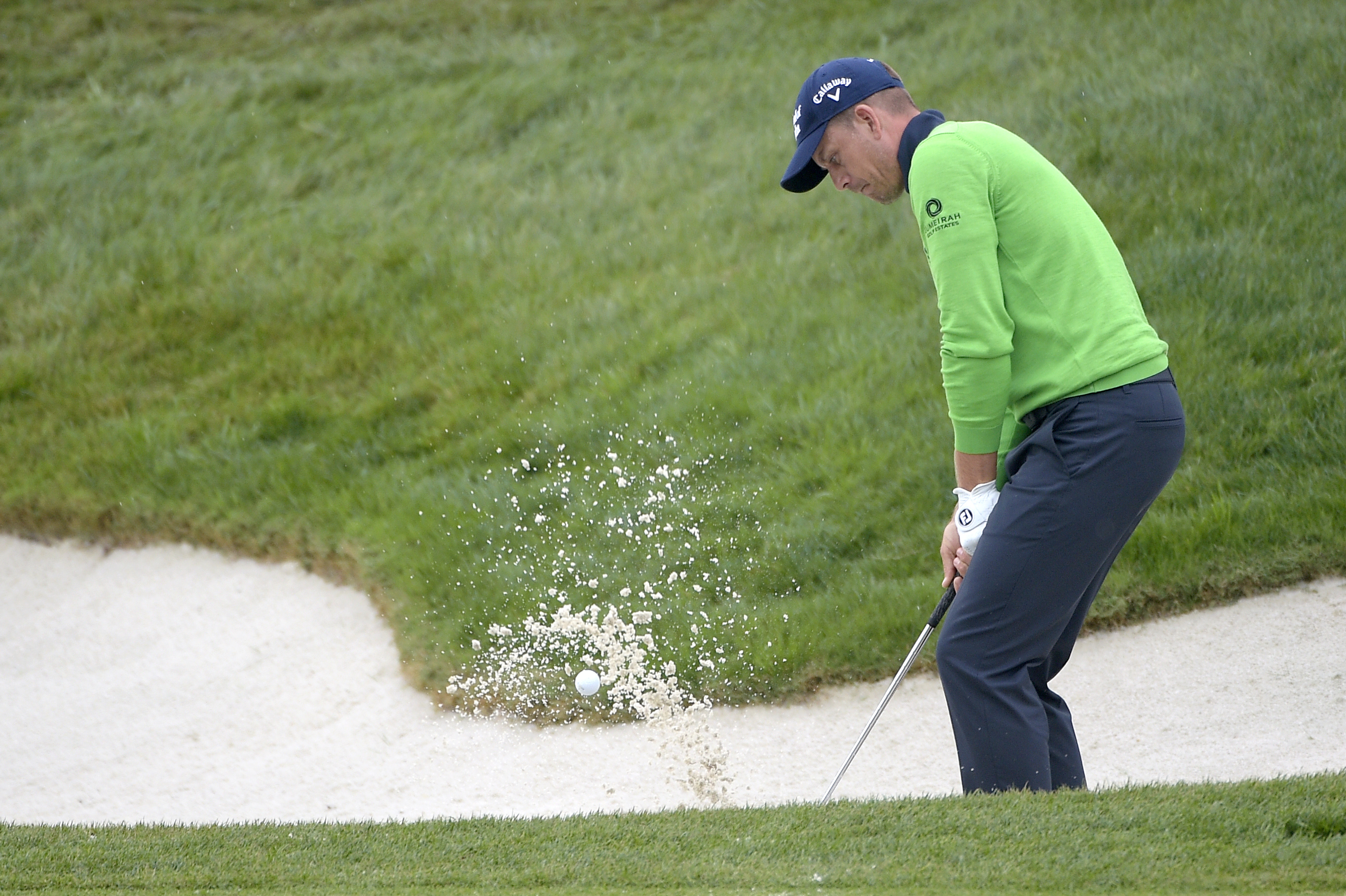 Day keeps the lead in the rain at Bay Hill