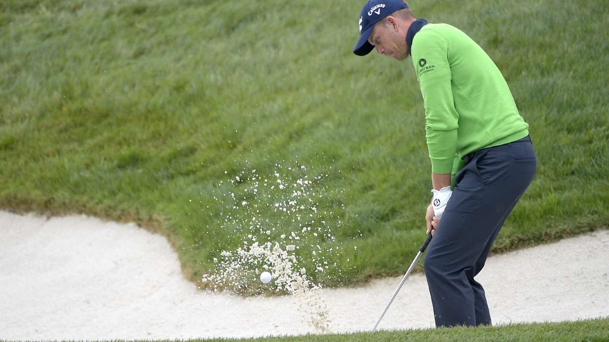 Day keeps the lead in the rain at Bay Hill