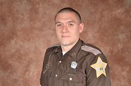 The Latest: Governor: Flags to half-staff for slain deputy