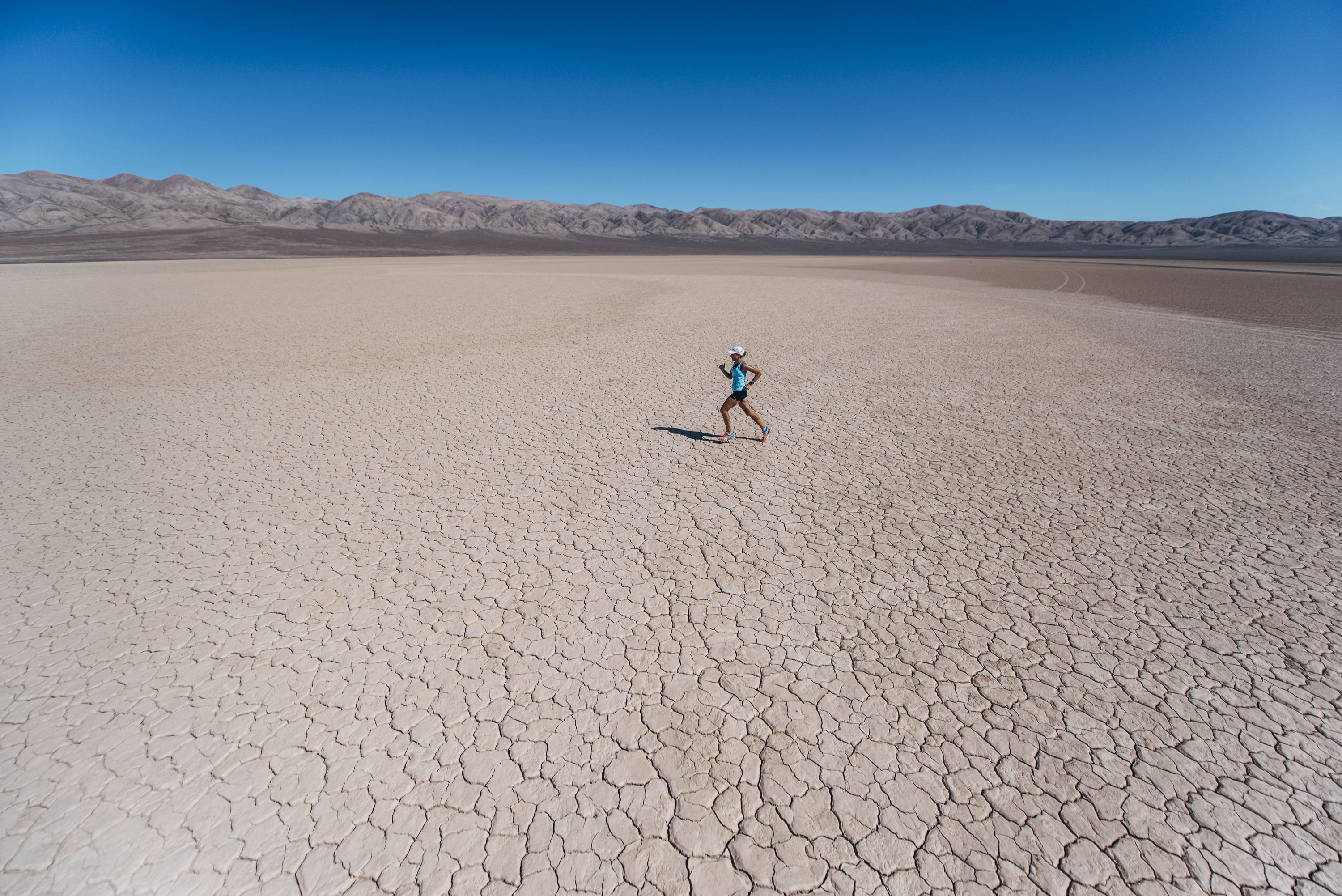 In this March 13, 2016, photo provided by Kelvin Trautman, Australian long-distance runner Mina Guli, the founder and CEO of Thirst, runs in the 7 Deserts Run4Water expedition in Atacama desert, Chile, while attempting to hoof through seven deserts on seven continents in seven weeks to raise awareness of worldwide water shortages, and she is almost done with the more-than-thousand-mile run. (Kelvin Trautman via AP)