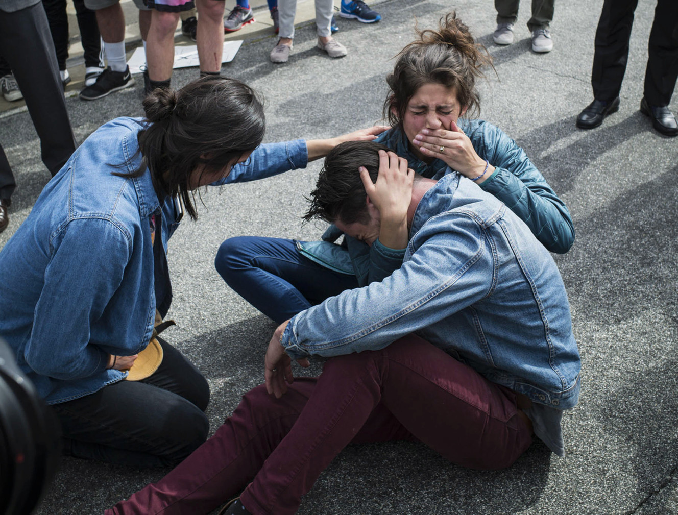 Graham, right front, and Lena Kelly, Lexi's foster aunt and uncle, break down in the street after family services came to take Lexi away from her foster family in Santa Clarita, Calif., Monday, March 21, 2016. Lexi, who spent most of her life with California foster parents, was removed from her home on Monday under a court order that concluded her native American blood requires her placement with relatives in Utah. (David Crane/Los Angeles Daily News via AP) (Photo: David Crane, Los Angeles Daily News)