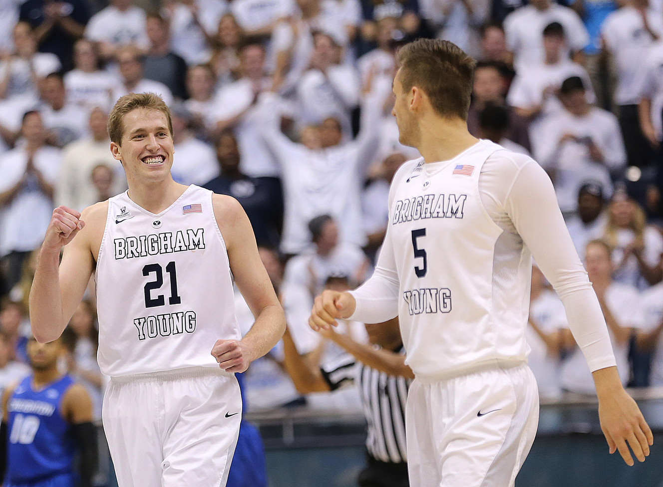 BYU forward Kyle Davis (21) looks over at teammate and BYU guard Kyle Collinsworth (5) and pumps his fist as BYU looks to defeat Creighton in NIT quarterfinal action at the Marriott Center in Provo Tuesday, March 22, 2016. (Photo: Scott G Winterton, Deseret News)