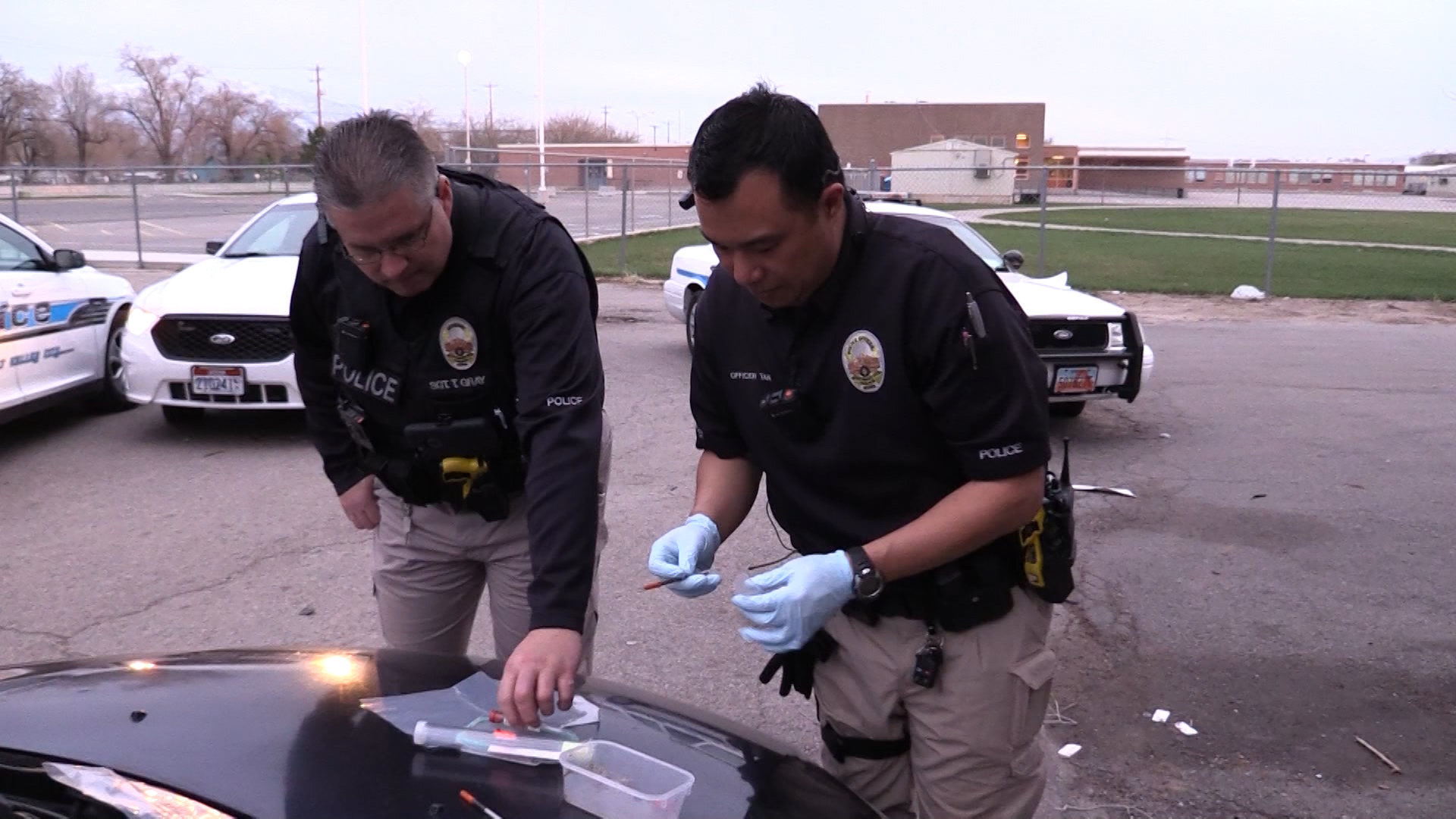 Officer Joe Tan (left) of West Valley Police Department's Crime Suppression Unit investigates following a hit-and-run accident where drugs were found in a vehicle. (Photo: KSL-TV)
