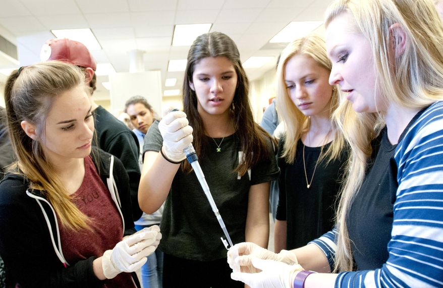 Logan High students learn about DNA extraction