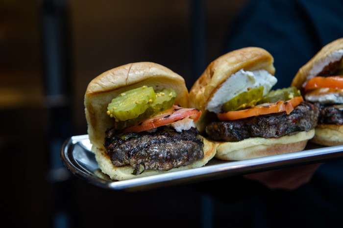 Hugh Acheson’s Cremini-Lamb Burger with charred scallions, Boursin, pickles and tomato on a potato roll at the James Beard Foundation’s Blended Burger Project launch event on March 28, 2016, at the James Beard House. (Photo: Ken Goodman)