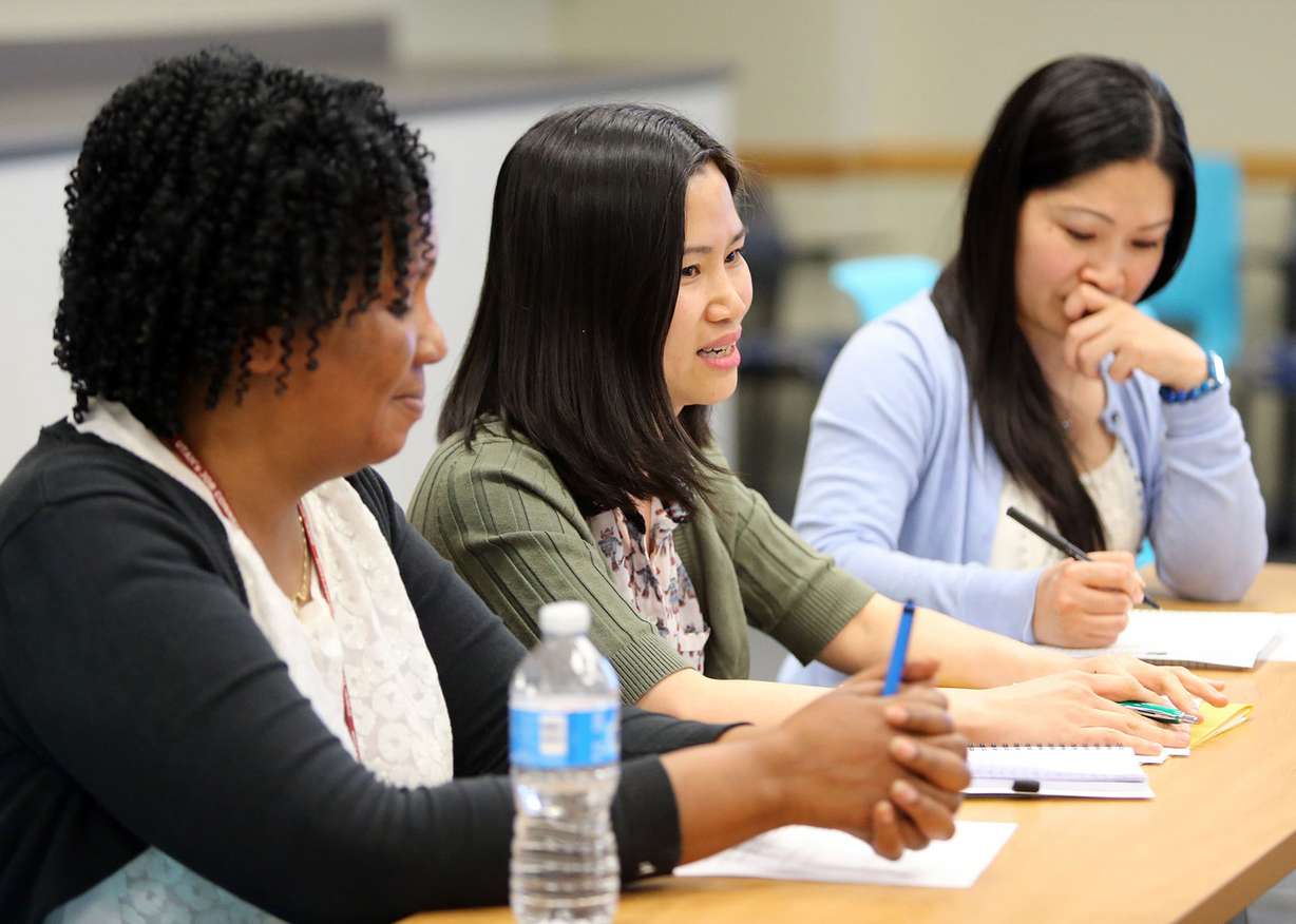 Antoinette Uwanyiugira, An Ha and Lam Nguyen attend a meeting about refugee community capacity building at the Utah Refugee Education and Training Center in South Salt Lake on Friday, April 1, 2016. Community capacity building is a conceptual approach to development that focuses on understanding the obstacles that inhibit people and organizations from realizing their development goals while enhancing the abilities that will allow them to achieve measurable and sustainable results. (Photo: Kristin Murphy, Deseret News)