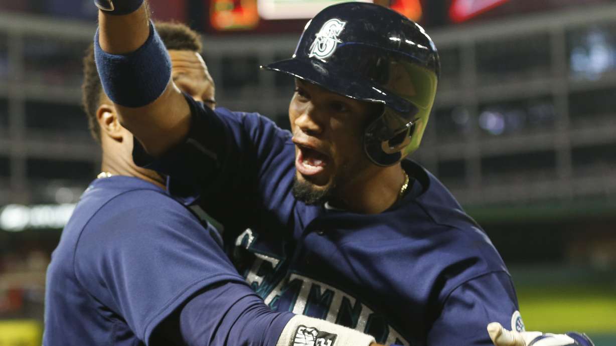 Cano homers twice, Mariners rally in 9th to win 9-5 at Texas