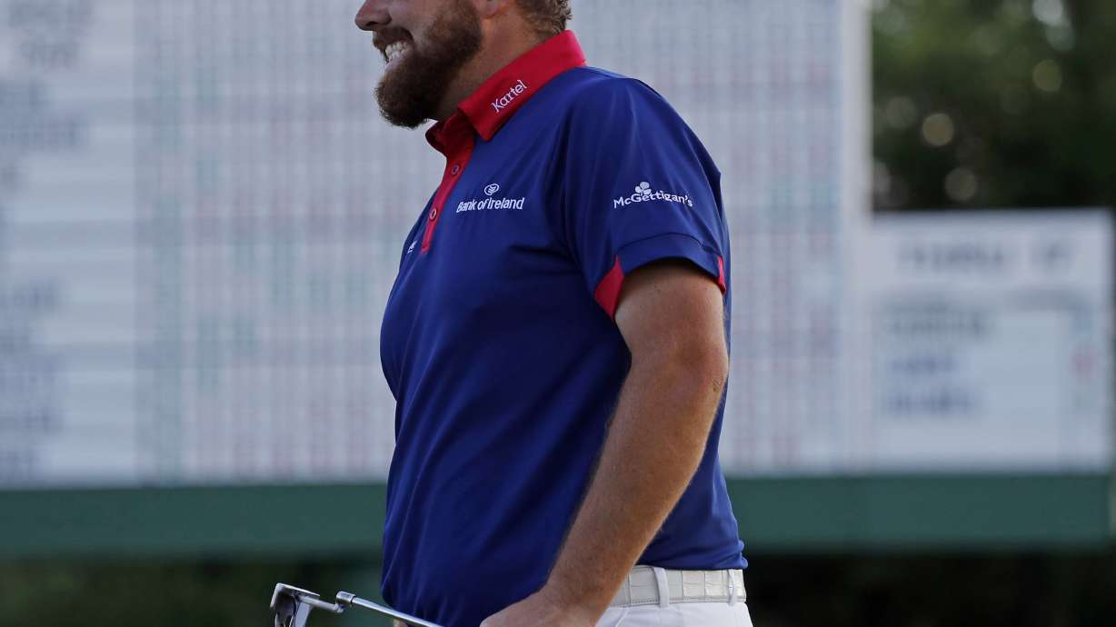 The Latest: Tears, frustration cap blustery day at Masters