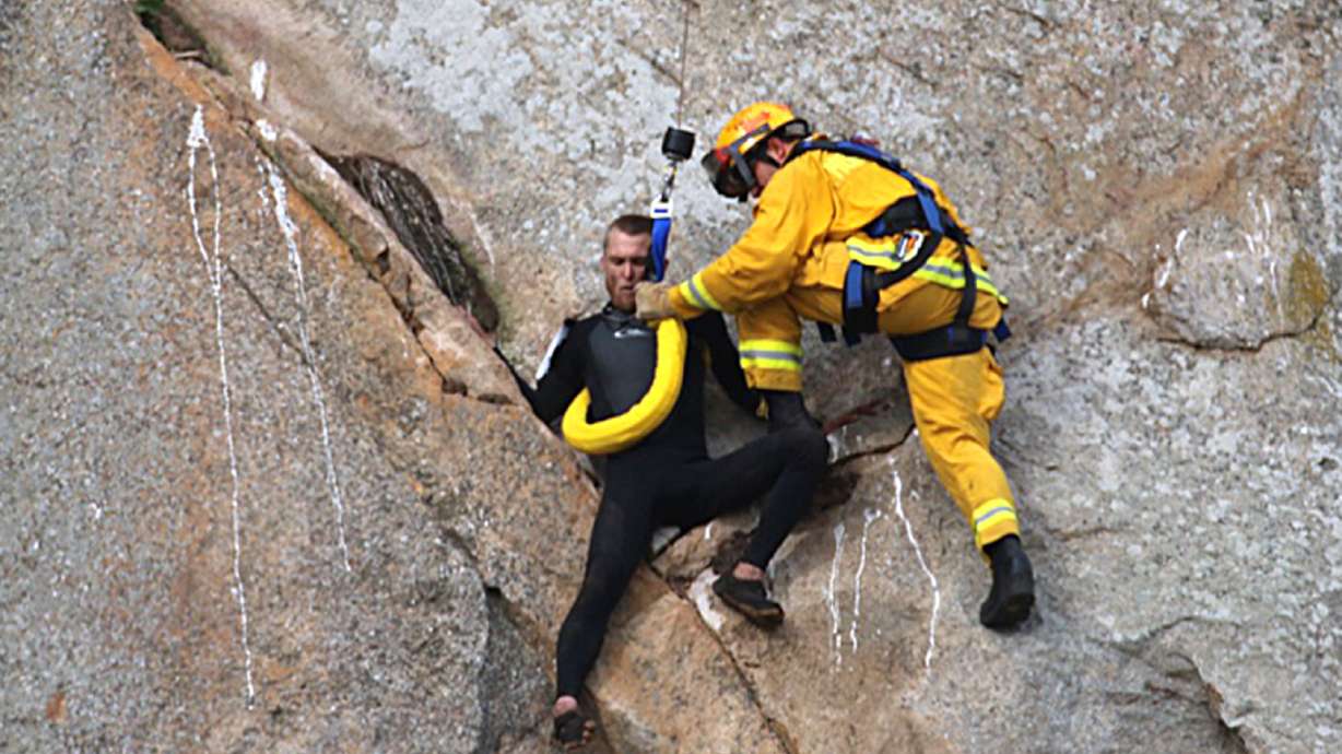 The Latest: Man who scaled cliff to propose later arrested