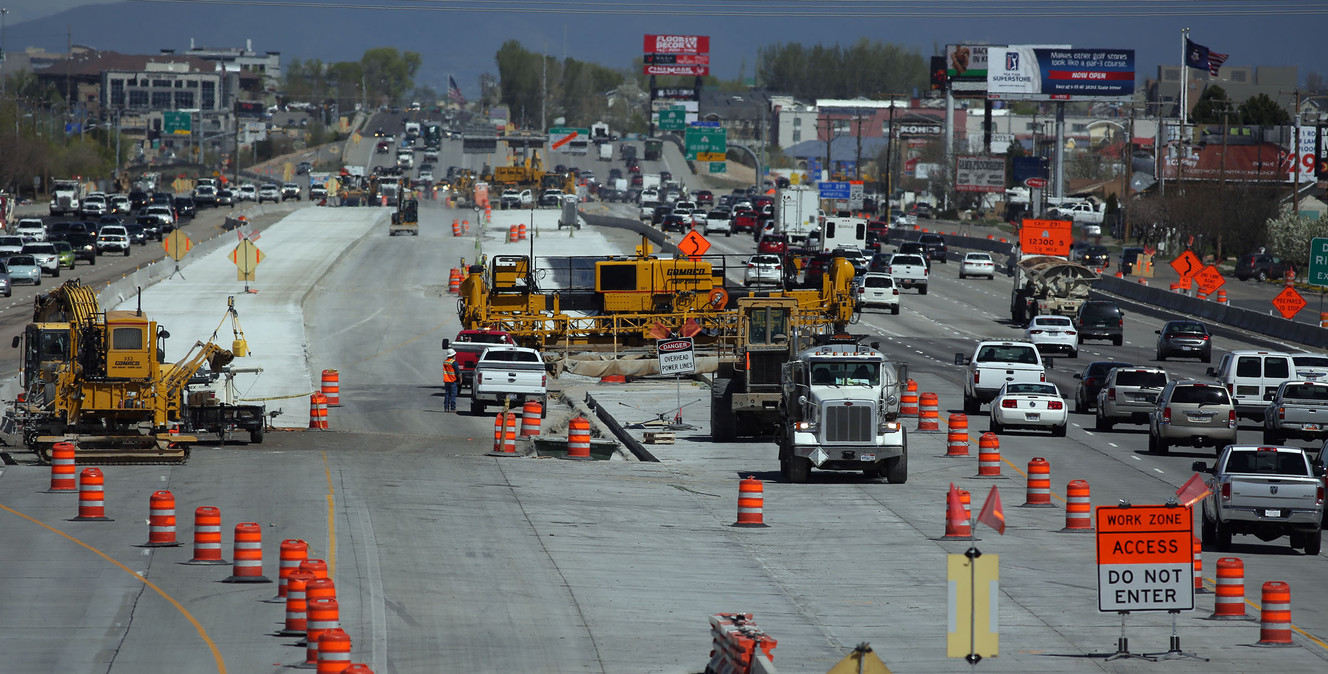 Traffic moves past construction workers and equipment for the Point Project on I-15 near Point of the Mountain on Tuesday, April 12, 2016. (Photo: Kristin Murphy, Deseret News)