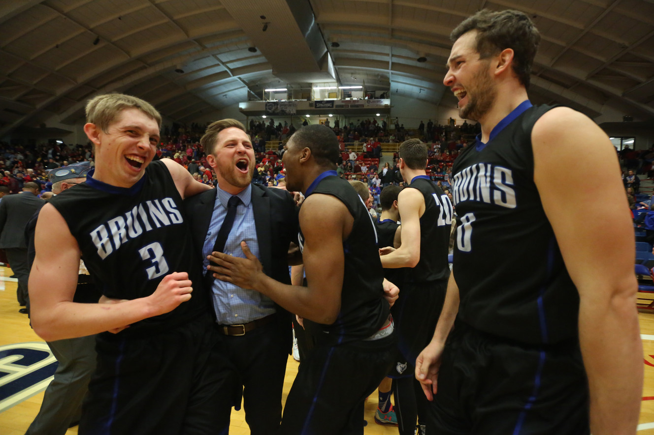 Salt Lake's Tyler Rawson, assistant coach Brian Swindlehurst, Christian Musoko and Gibson Johnson after winning the championship game of the NJCAA tournament 74-63 over Hutchinson, March 19, 2016 at the Sports Arena in Hutchinson, Kan. (Photo: Travis Morisse, The Hutchinson News via AP)