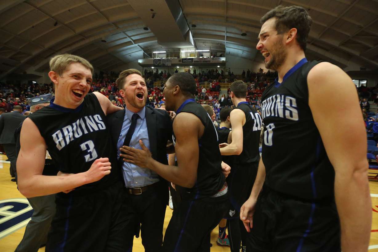Salt Lake's Tyler Rawson, assistant coach Brian Swindlehurst, Christian Musoko and Gibson Johnson after winning the championship game of the NJCAA tournament 74-63 over Hutchinson, March 19, 2016 at the Sports Arena in Hutchinson, Kan. (Photo: Travis Morisse, The Hutchinson News via AP)